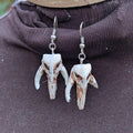 Mythosaur Skull Dangle Earrings